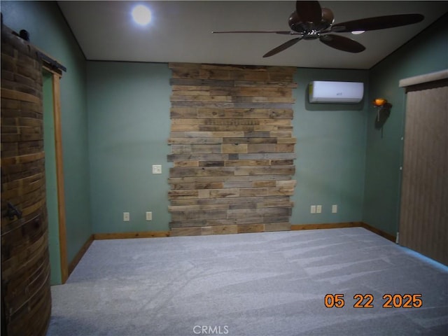 635 5th St, Willows, CA 95988 - spare room with a wall mounted AC, a ceiling fan, a barn door, carpet floors, and lofted ceiling