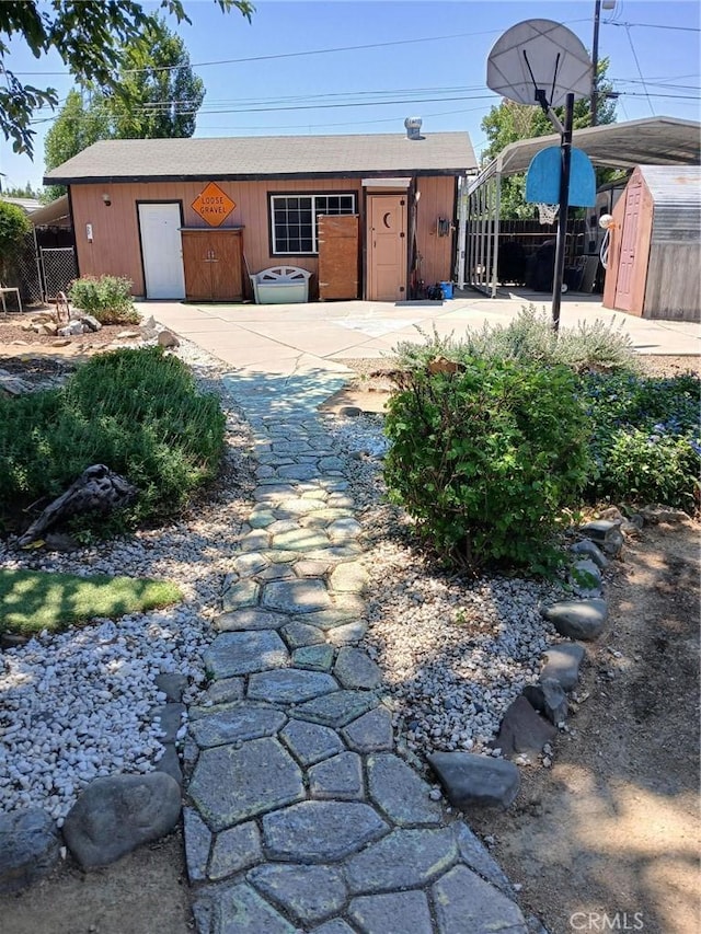 635 5th St, Willows, CA 95988 - garage featuring a storage shed