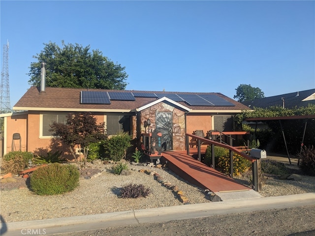 635 5th St, Willows, CA 95988 - single story home with solar panels, stucco siding, and stone siding