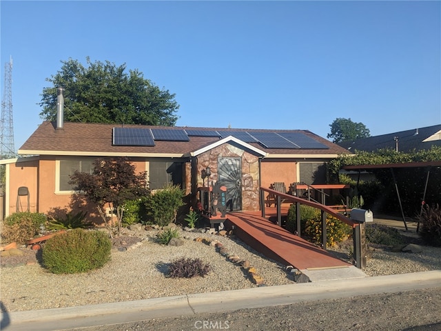 635 5th St, Willows, CA 95988 - ranch-style home with solar panels, stucco siding, and stone siding