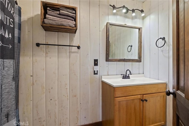 635 5th St, Willows, CA 95988 - bathroom featuring vanity and wood walls