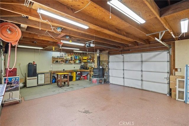635 5th St, Willows, CA 95988 - garage with a workshop area and a garage door opener