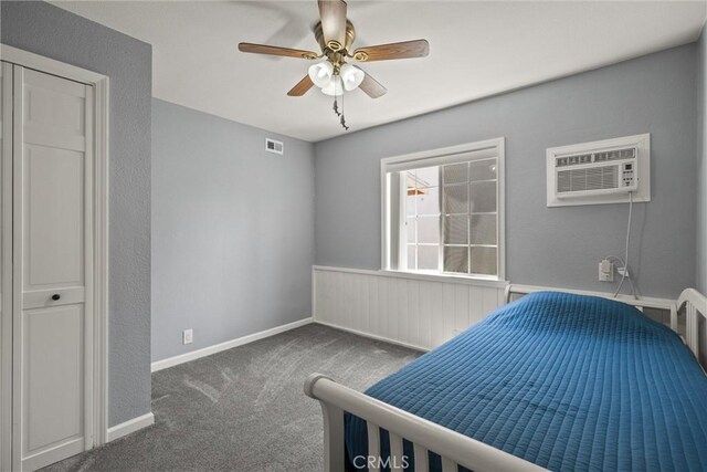 635 5th St, Willows, CA 95988 - bedroom featuring carpet, a wall unit AC, and a ceiling fan