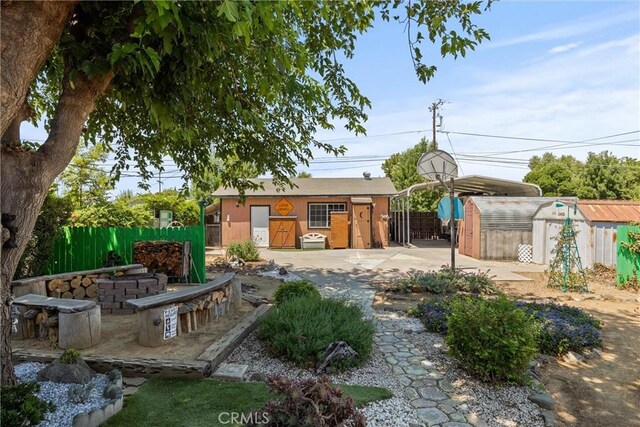 635 5th St, Willows, CA 95988 - view of yard with a detached carport, a storage shed, and a patio
