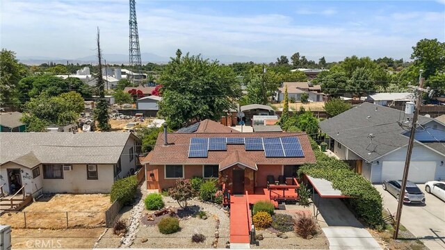 635 5th St, Willows, CA 95988 - view of front of home with roof mounted solar panels, a residential view, and stucco siding