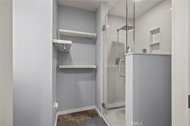 635 5th St, Willows, CA 95988 - bathroom with a shower stall and stone finish floors