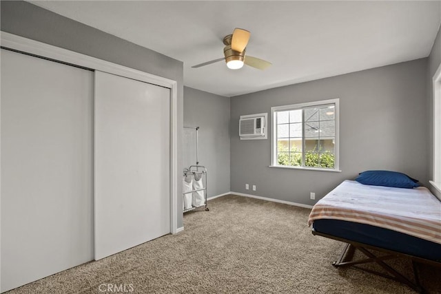 635 5th St, Willows, CA 95988 - bedroom with carpet floors, an AC wall unit, a closet, and a ceiling fan