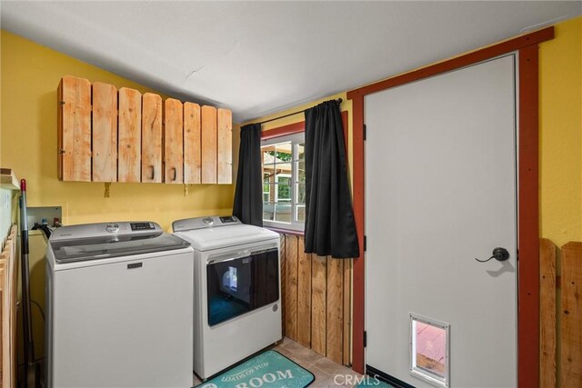 635 5th St, Willows, CA 95988 - laundry area with washer and clothes dryer, cabinet space, and light tile patterned floors