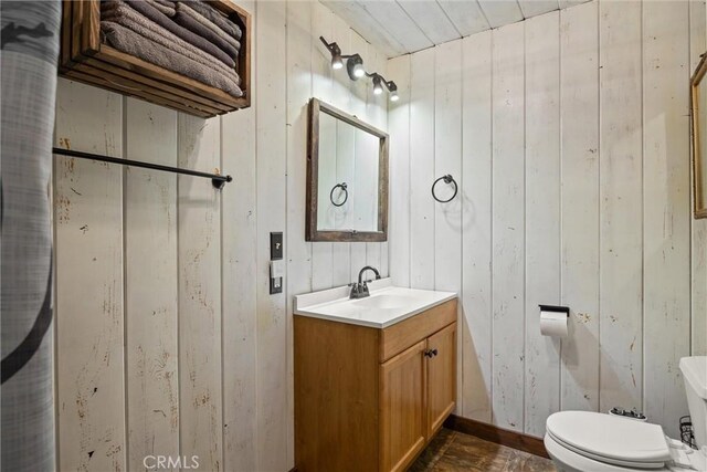 635 5th St, Willows, CA 95988 - bathroom featuring vanity and wooden walls