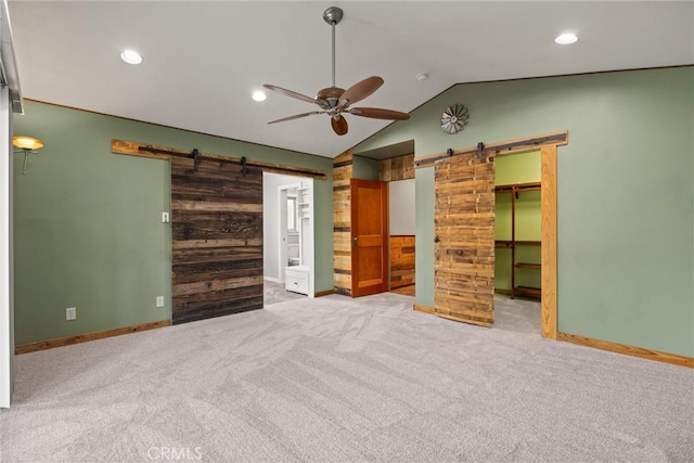 635 5th St, Willows, CA 95988 - unfurnished bedroom featuring a barn door, lofted ceiling, carpet, recessed lighting, and a spacious closet
