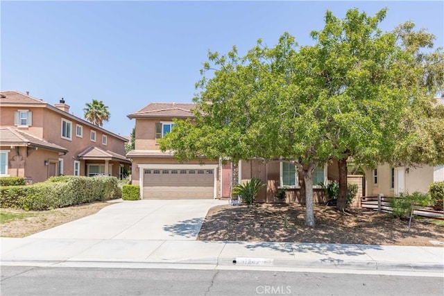 37245 La Lune Ave, Murrieta, CA 92563 - obstructed view of property with a garage, driveway, and stucco siding