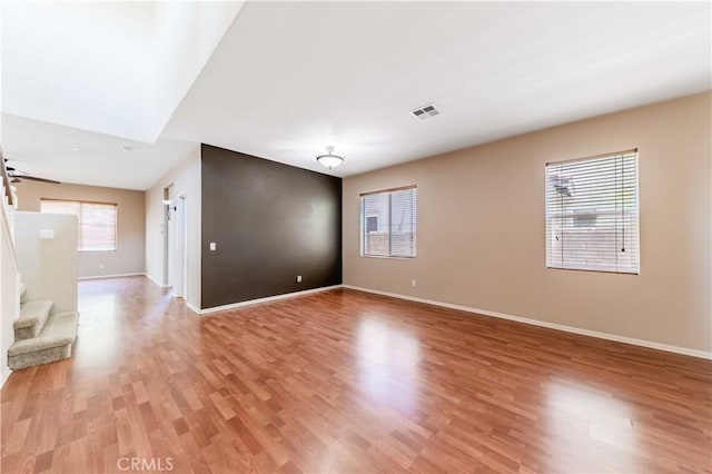 37245 La Lune Ave, Murrieta, CA 92563 - spare room with light wood-type flooring, baseboards, and stairs