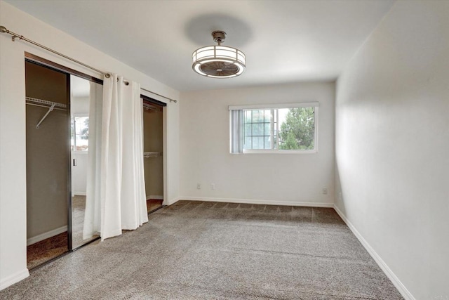 4570 54th St Unit 208, San Diego, CA 92115 - unfurnished bedroom with multiple closets, carpet floors, and baseboards