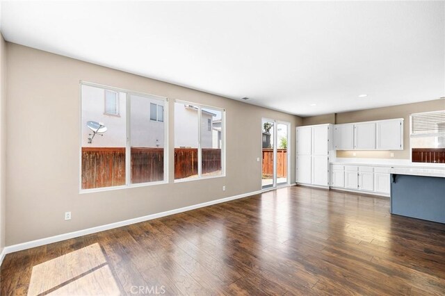 32702 Willowvail Cir, Temecula, CA 92592 - unfurnished living room featuring baseboards, dark wood-style flooring, and recessed lighting