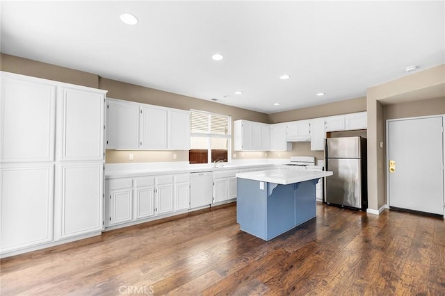 32702 Willowvail Cir, Temecula, CA 92592 - kitchen with freestanding refrigerator, white dishwasher, white cabinetry, light countertops, and recessed lighting
