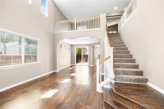 32702 Willowvail Cir, Temecula, CA 92592 - entryway featuring wood finished floors, stairway, baseboards, and a high ceiling