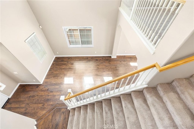 32702 Willowvail Cir, Temecula, CA 92592 - staircase with a high ceiling, wood finished floors, and baseboards