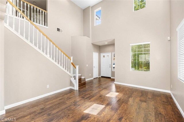 32702 Willowvail Cir, Temecula, CA 92592 - entryway featuring wood finished floors, stairway, baseboards, plenty of natural light, and a high ceiling