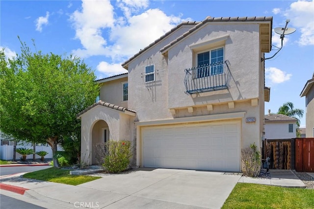 32702 Willowvail Cir, Temecula, CA 92592 - mediterranean / spanish house featuring a garage, stucco siding, a balcony, driveway, and a tile roof