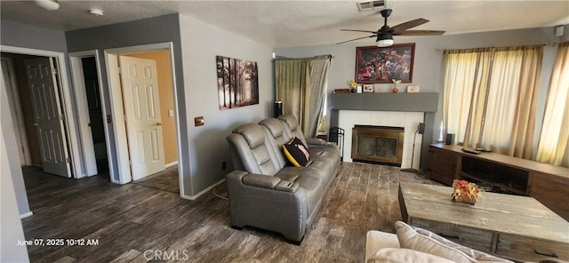 12609 Gentle Breeze Way, Victorville, CA 92392 - living area with wood finished floors, ceiling fan, a fireplace, and baseboards