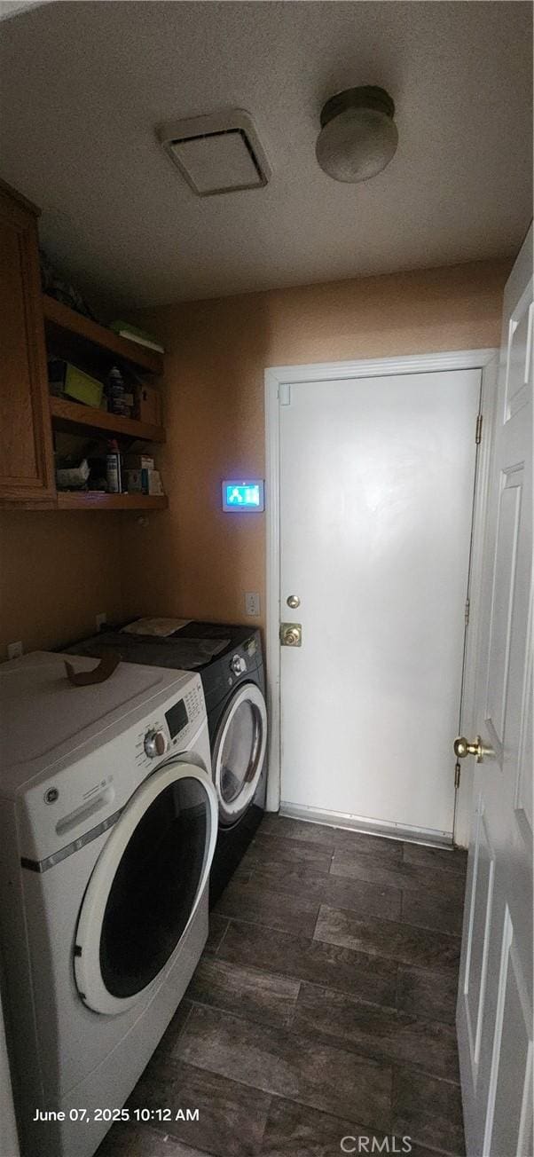 12609 Gentle Breeze Way, Victorville, CA 92392 - laundry room with washing machine and dryer, cabinet space, and dark wood-style floors