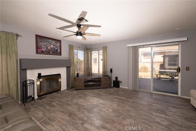 12609 Gentle Breeze Way, Victorville, CA 92392 - living area featuring a ceiling fan, a fireplace, and wood finished floors