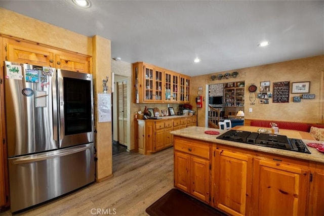 114 Starvation Flats Rd, Big Bear Lake, CA 92315 - kitchen with smart refrigerator, black gas stovetop, light wood finished floors, light countertops, and glass insert cabinets
