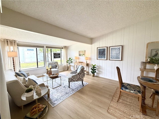 1533 Merion Way Unit 26K, Seal Beach, CA 90740 - living room featuring a textured ceiling and light wood-type flooring