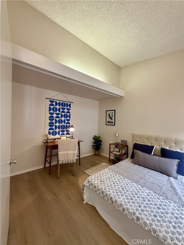 1533 Merion Way Unit 26K, Seal Beach, CA 90740 - bedroom with hardwood / wood-style floors and a textured ceiling
