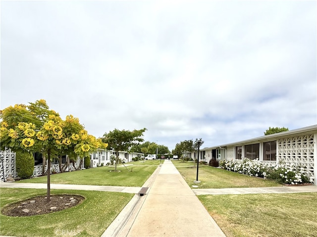 1533 Merion Way Unit 26K, Seal Beach, CA 90740 - surrounding community with a lawn