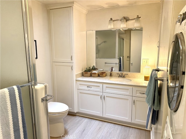 1533 Merion Way Unit 26K, Seal Beach, CA 90740 - full bath featuring vanity, a shower with shower door, and wood finished floors