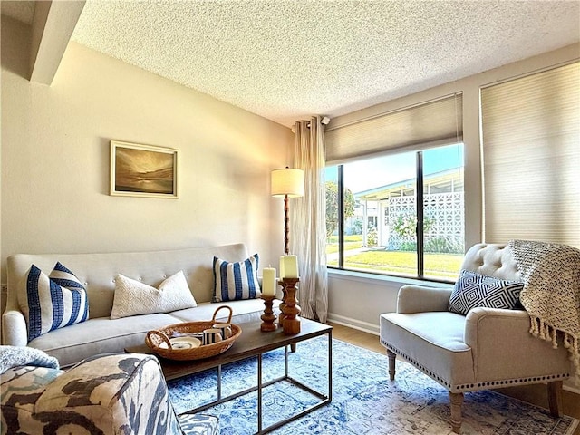 1533 Merion Way Unit 26K, Seal Beach, CA 90740 - living area featuring wood finished floors and a textured ceiling