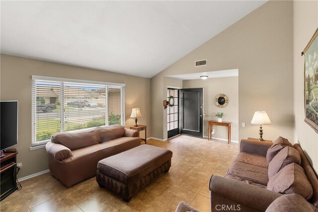 26231 Avenida Calidad, Mission Viejo, CA 92691 - living room with light tile patterned flooring and high vaulted ceiling