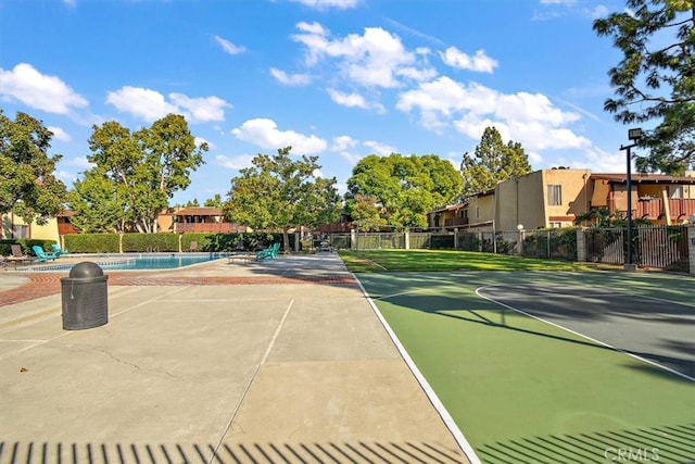 1000 W Macarthur Blvd Unit 44, Santa Ana, CA 92707 - view of tennis court featuring a community pool and a residential view