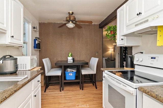 1000 W Macarthur Blvd Unit 44, Santa Ana, CA 92707 - kitchen with white appliances, under cabinet range hood, light wood-style flooring, ceiling fan, and white cabinetry
