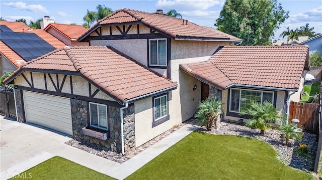 3372 Buckingham Rd, Chino Hills, CA 91709 - view of front of house with a tiled roof, stucco siding, driveway, a garage, and stone siding