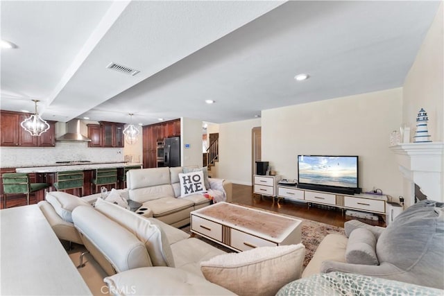 3372 Buckingham Rd, Chino Hills, CA 91709 - living room with dark wood-type flooring, recessed lighting, a chandelier, and stairway