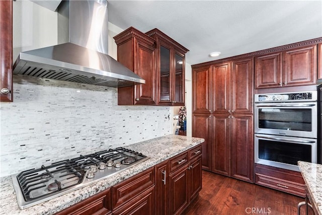 3372 Buckingham Rd, Chino Hills, CA 91709 - kitchen with wall chimney range hood, appliances with stainless steel finishes, dark wood-type flooring, and light stone countertops