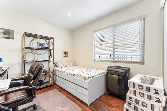 3372 Buckingham Rd, Chino Hills, CA 91709 - bedroom with dark wood-type flooring and an office area