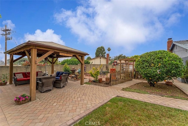 7669 Granby Ave, Rancho Cucamonga, CA 91730 - fenced backyard with a gazebo, outdoor lounge area, and a patio area