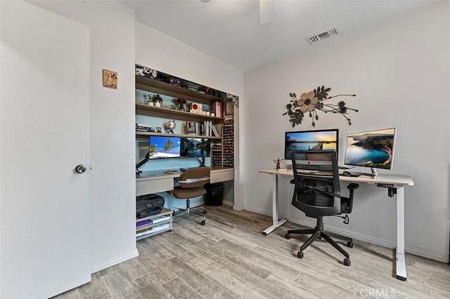 7669 Granby Ave, Rancho Cucamonga, CA 91730 - home office with wood finished floors, a ceiling fan, and baseboards