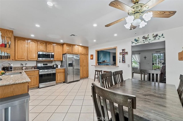 7669 Granby Ave, Rancho Cucamonga, CA 91730 - kitchen featuring stainless steel appliances, a sink, a ceiling fan, recessed lighting, and light tile patterned floors