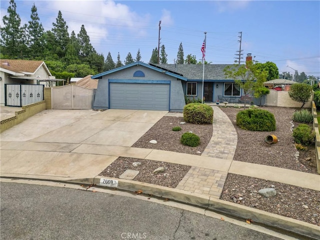 7669 Granby Ave, Rancho Cucamonga, CA 91730 - single story home with a gate, driveway, an attached garage, and stucco siding