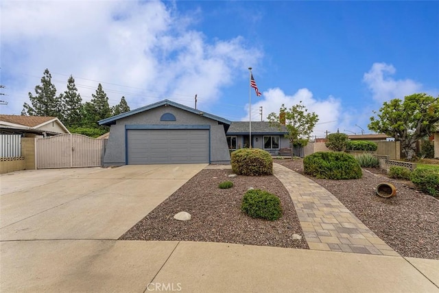 7669 Granby Ave, Rancho Cucamonga, CA 91730 - ranch-style home featuring a gate, concrete driveway, an attached garage, and stucco siding