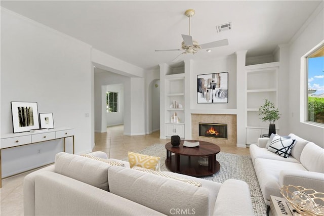 69635 Valle De Costa, Cathedral City, CA 92234 - living area featuring built in features, ceiling fan, baseboards, and light tile patterned floors
