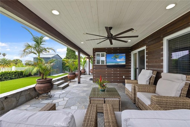 4735 Sunny Hills Rd, Oceanside, CA 92056 - fenced backyard featuring an outdoor hangout area, a patio area, and ceiling fan