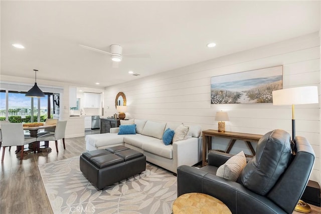 4735 Sunny Hills Rd, Oceanside, CA 92056 - living area featuring light wood-style floors, recessed lighting, a ceiling fan, and wooden walls