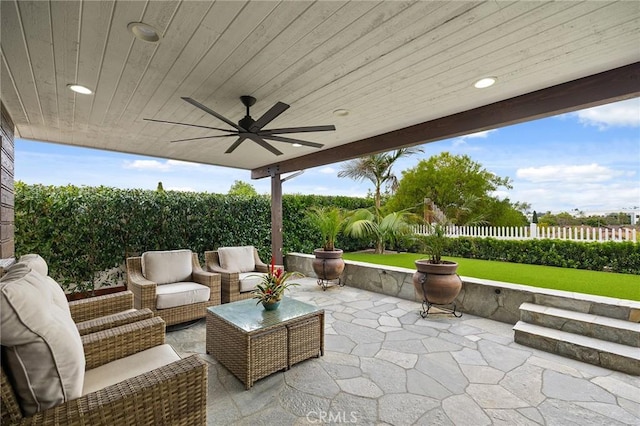 4735 Sunny Hills Rd, Oceanside, CA 92056 - fenced backyard featuring a patio area, a ceiling fan, and an outdoor hangout area
