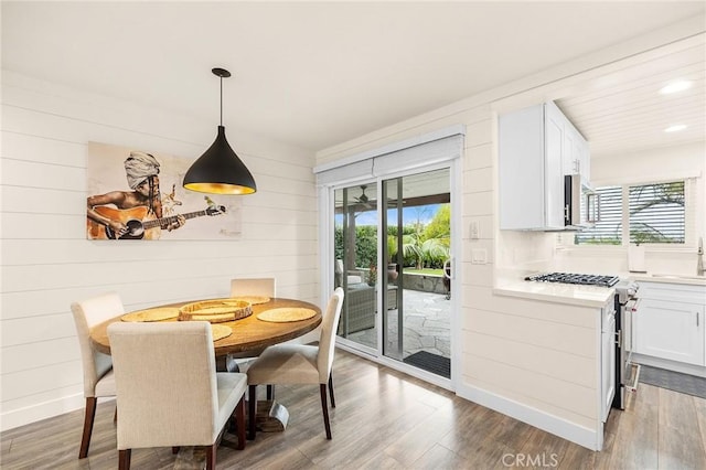 4735 Sunny Hills Rd, Oceanside, CA 92056 - dining area featuring healthy amount of natural light, wood finished floors, recessed lighting, and wood walls