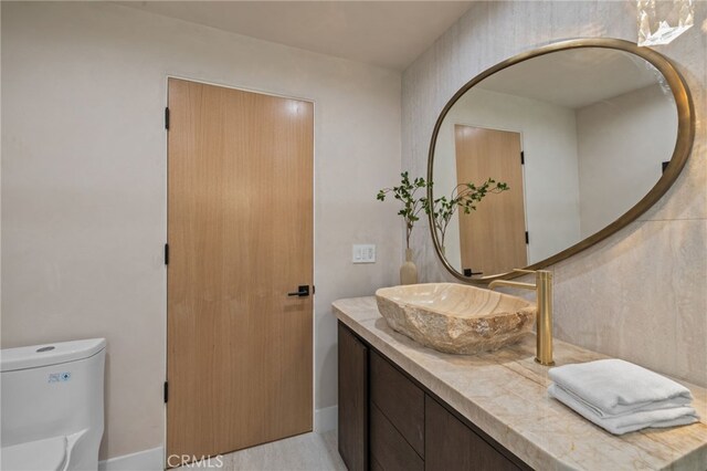 721 Wilson Ct, Burbank, CA 91501 - bathroom featuring vanity, toilet, and baseboards
